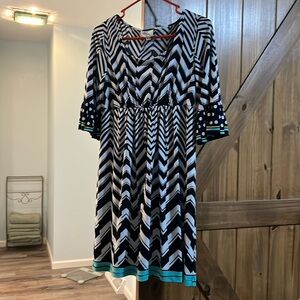 Nice used lightweight dress. Navy, white, teal pattern.